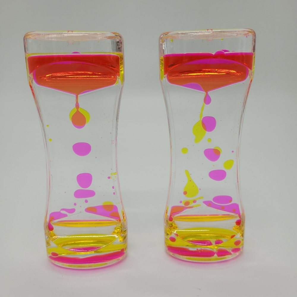 Super Z Outlet Liquid Motion Bubbler Set Of 2 Pink Yellow Sensory Quiet Play NEW